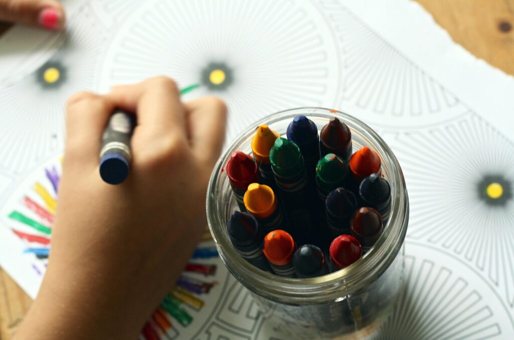 Child coloring at a clean, well-maintained daycare facility professionally cleaned by Fort Worth Cleaning Professionals.
